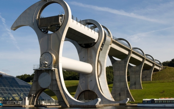 The Falkirk Wheel, named after the nearby town of Falkirk in Central Scotland, is a rotating boat lift connecting the Forth and Clyde Canal with the Union Canal. The two canals were previously connected by a series of 11 locks, but by the 1930s these had fallen into disuse, were filled in and the land built upon.